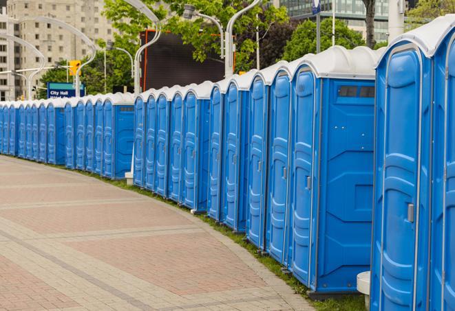 a row of portable restrooms at a fairground, offering visitors a clean and hassle-free experience in krum